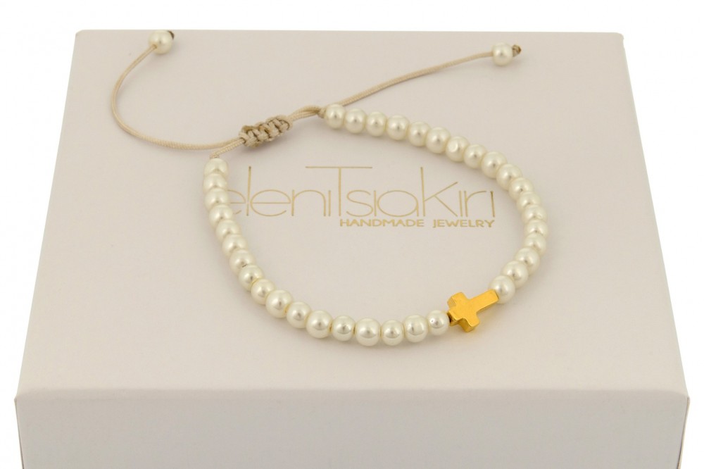 Silver cross on pearls