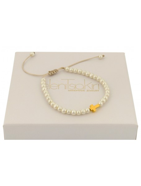 Silver cross on pearls